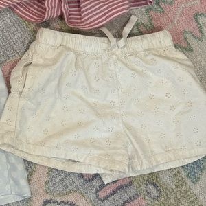 White eyelet shorts. Size 7/8 pockets. Drawstring waist.